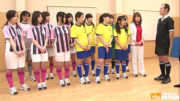 Japanese female team listen and take a lesson from their coach