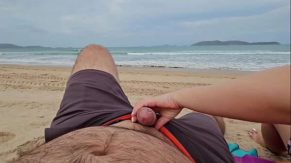 Cute Babe Sucking Cock on a public Beach and receives a mouth Creampie