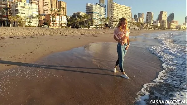 Wet shoot on a public beach with Crazy Model. Risky outdoor masturbation. Foot fetish. Pee in jeans.